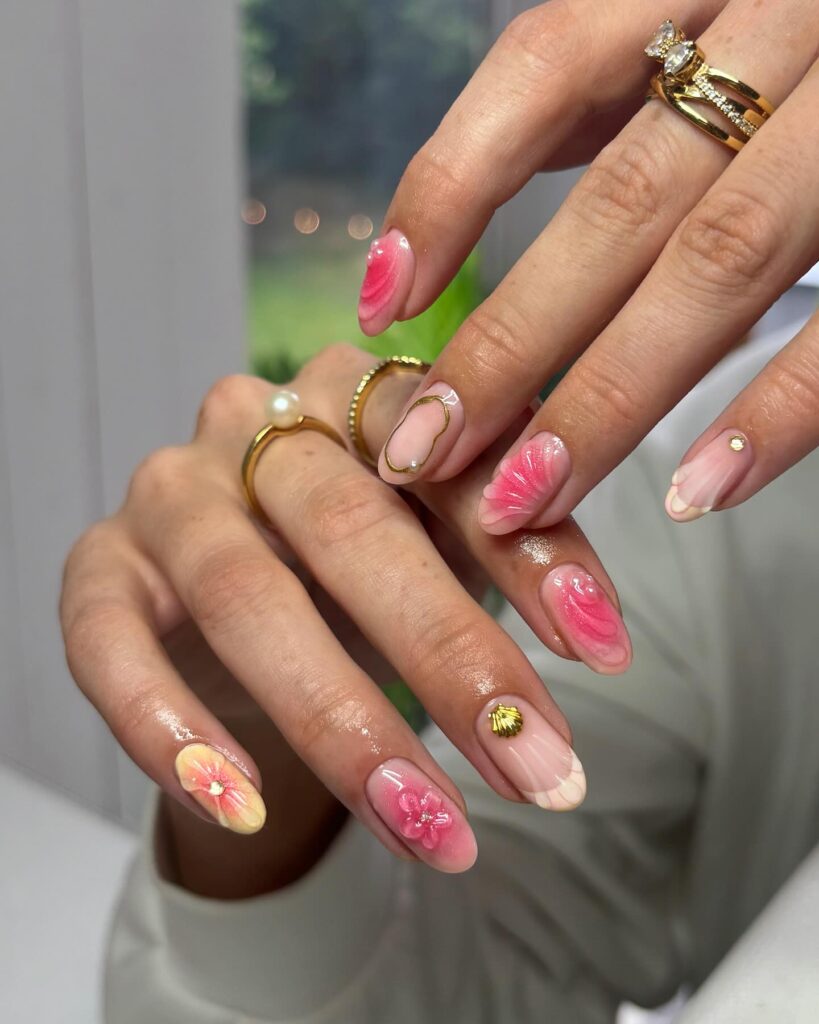 Romantic Summer Almond Nails with Shell Art, Floral Accents, and Gold Charms