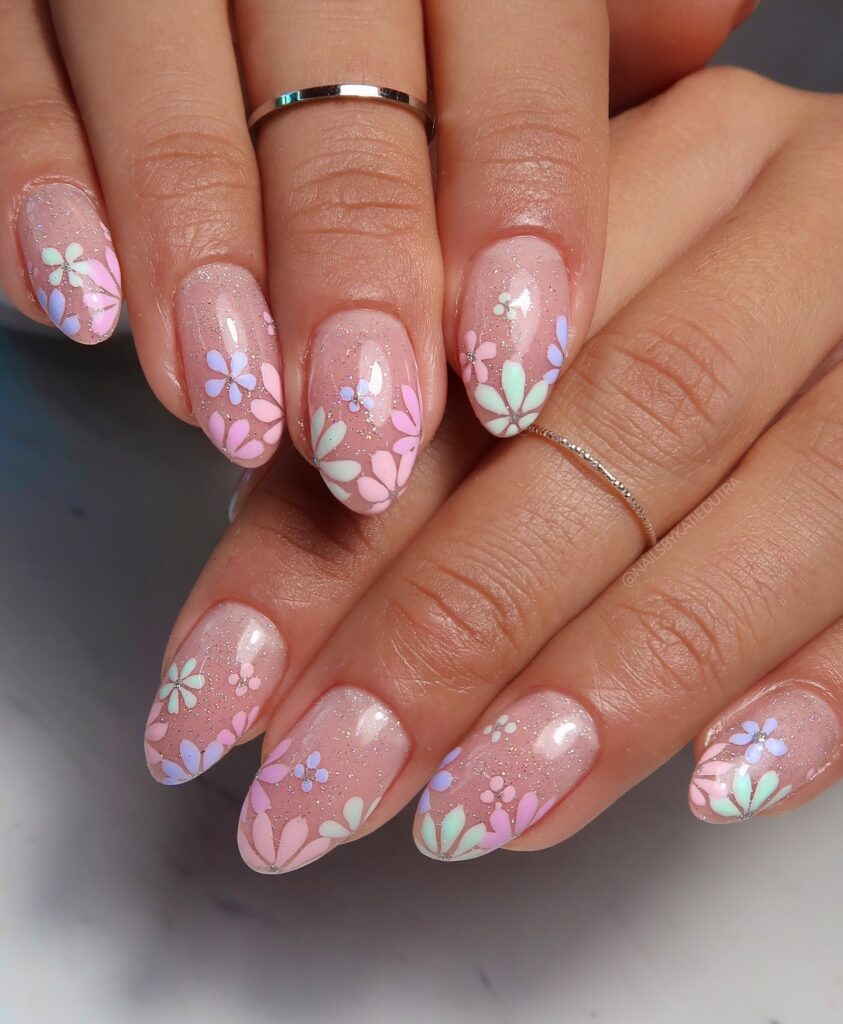 Shimmering Pink Almond Nails with Pastel Garden Flowers for a Dreamy Spring Design