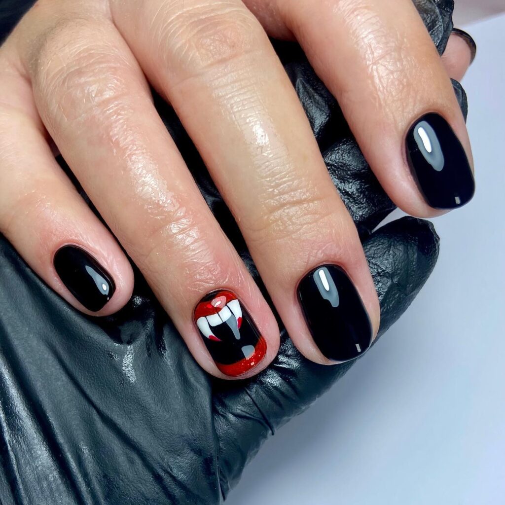 Short Black Vampire Fang Nails with Red Lips – Halloween Nail Art Idea