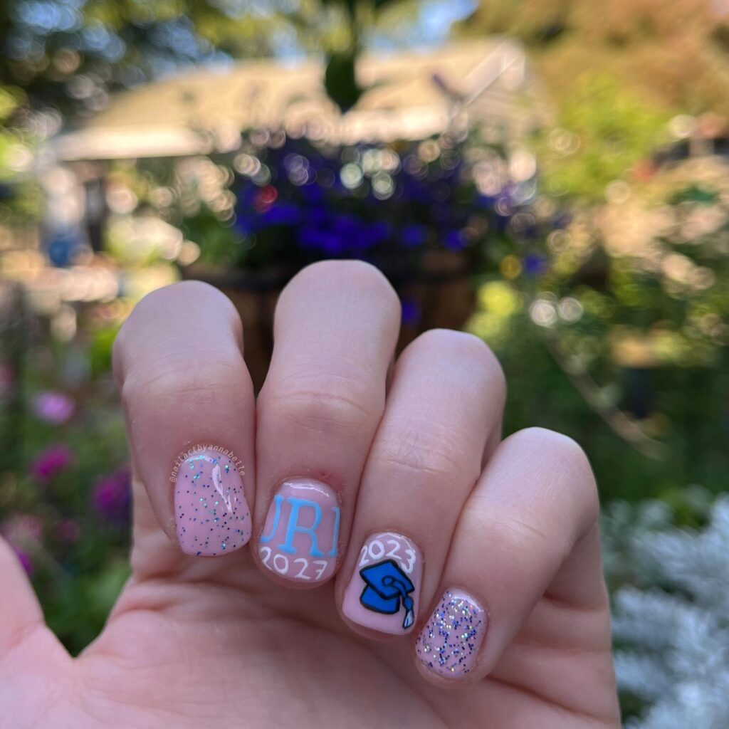 Short Pink Glitter Graduation Nail Ideas with Hand-Painted Cap and Initials