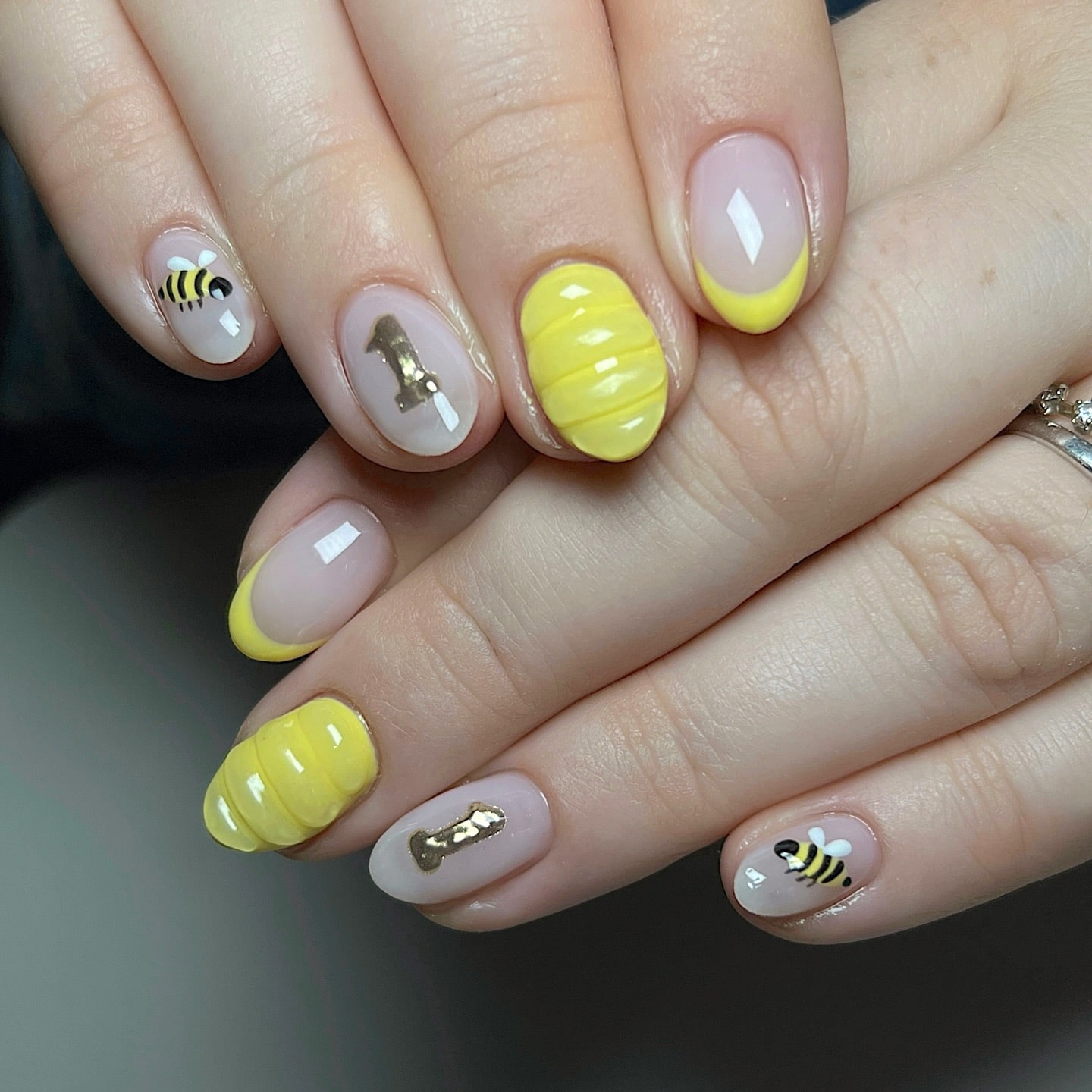 Short Rounded Nails with Yellow French Tips, Honeycomb Texture, and Cute Bee Accents