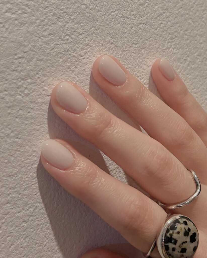 Short Rounded Nude Nails with Glossy Finish for Minimalist Chic