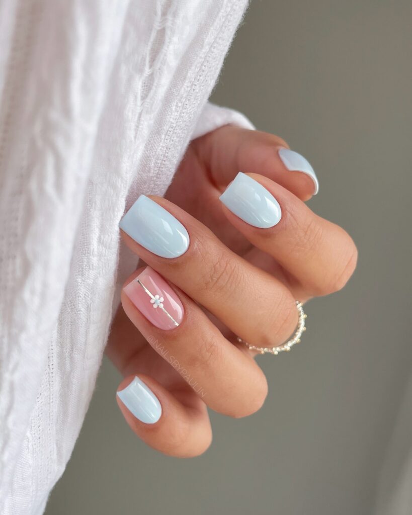 Short Square Nails in Pastel Blue with Floral Accents for a Fresh Spring Look