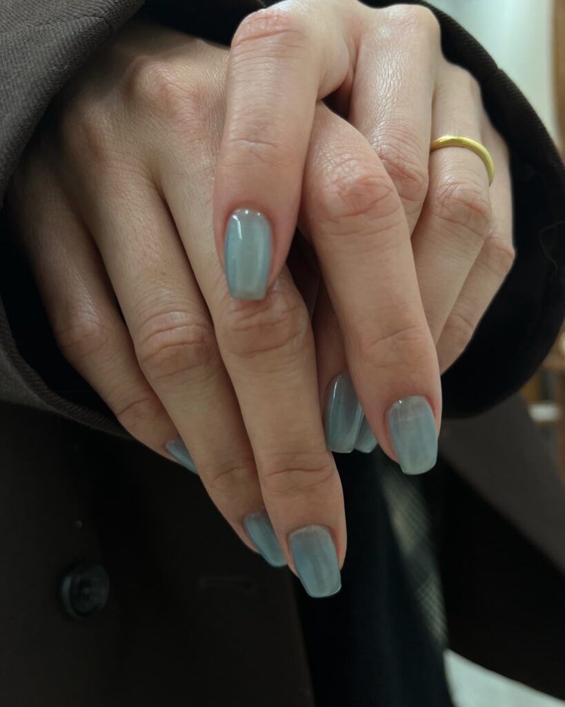 Soft square misty blue short nails with iridescent glossy finish for everyday minimalist style