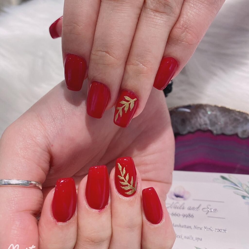 Square Red Nails with Gold Leaf Details for an Artistic, Luxurious Finish