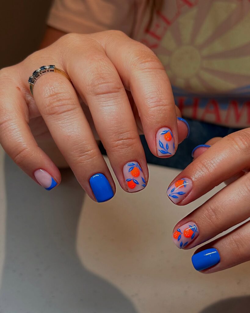 Square Summer Nails with Cobalt Blue Polish and Hand-Painted Orange Fruit Art