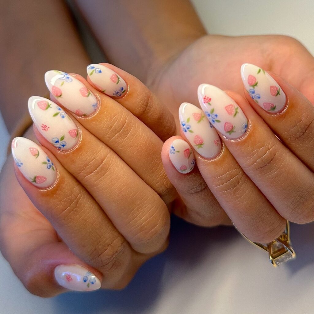 Strawberries and Florals on Milky Nude Almond Nails for a Sweet, Whimsical Vibe