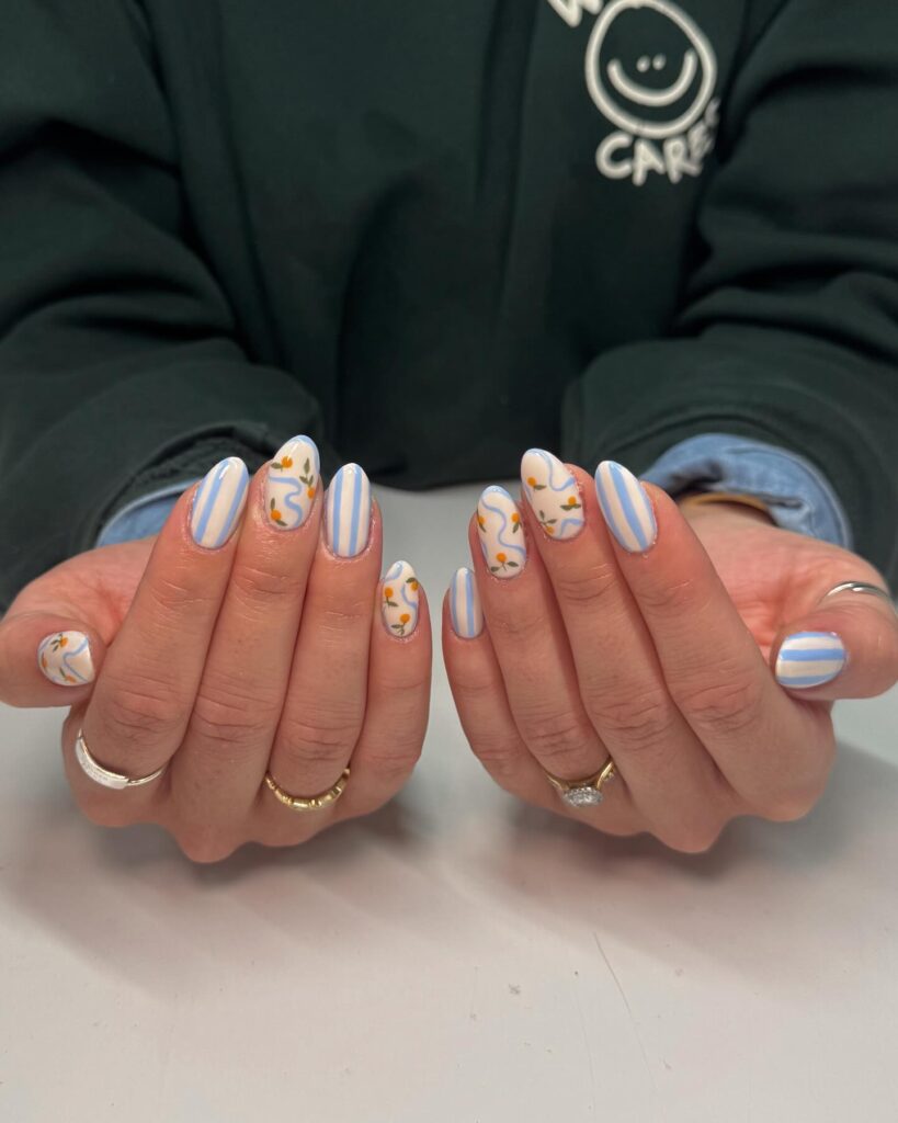 Striped and Floral Almond Nails with a White Base for a Breezy Garden Summer Look