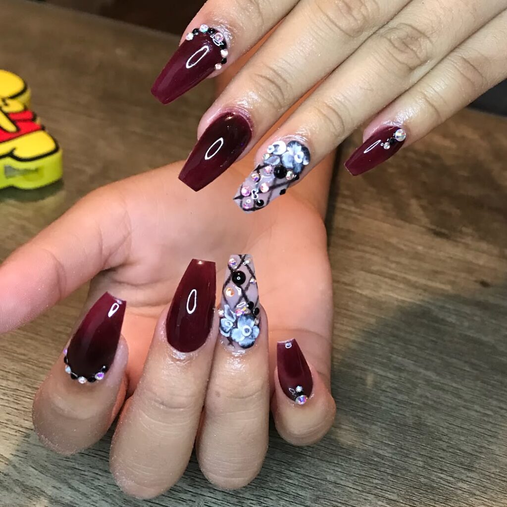 Wine red coffin nails with black lace and rhinestones for glamorous graduation nails